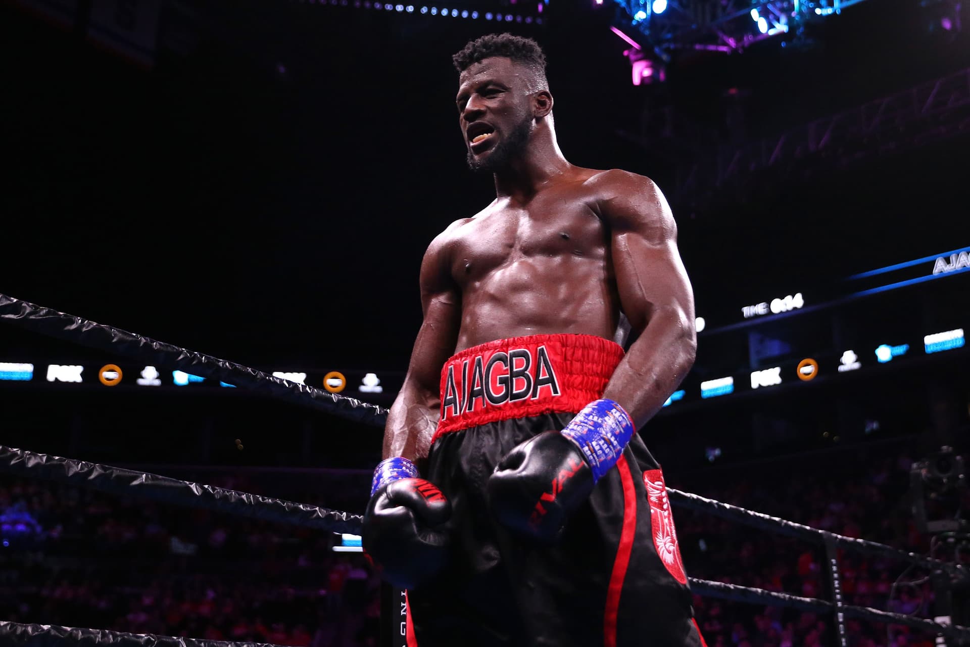 Efe Ajagba celebrates after defeating Razvan Cojanu