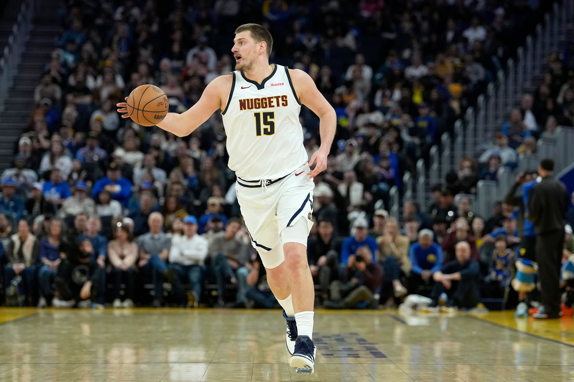 Nikola Jokic of the Denver Nuggets dribbles the ball
