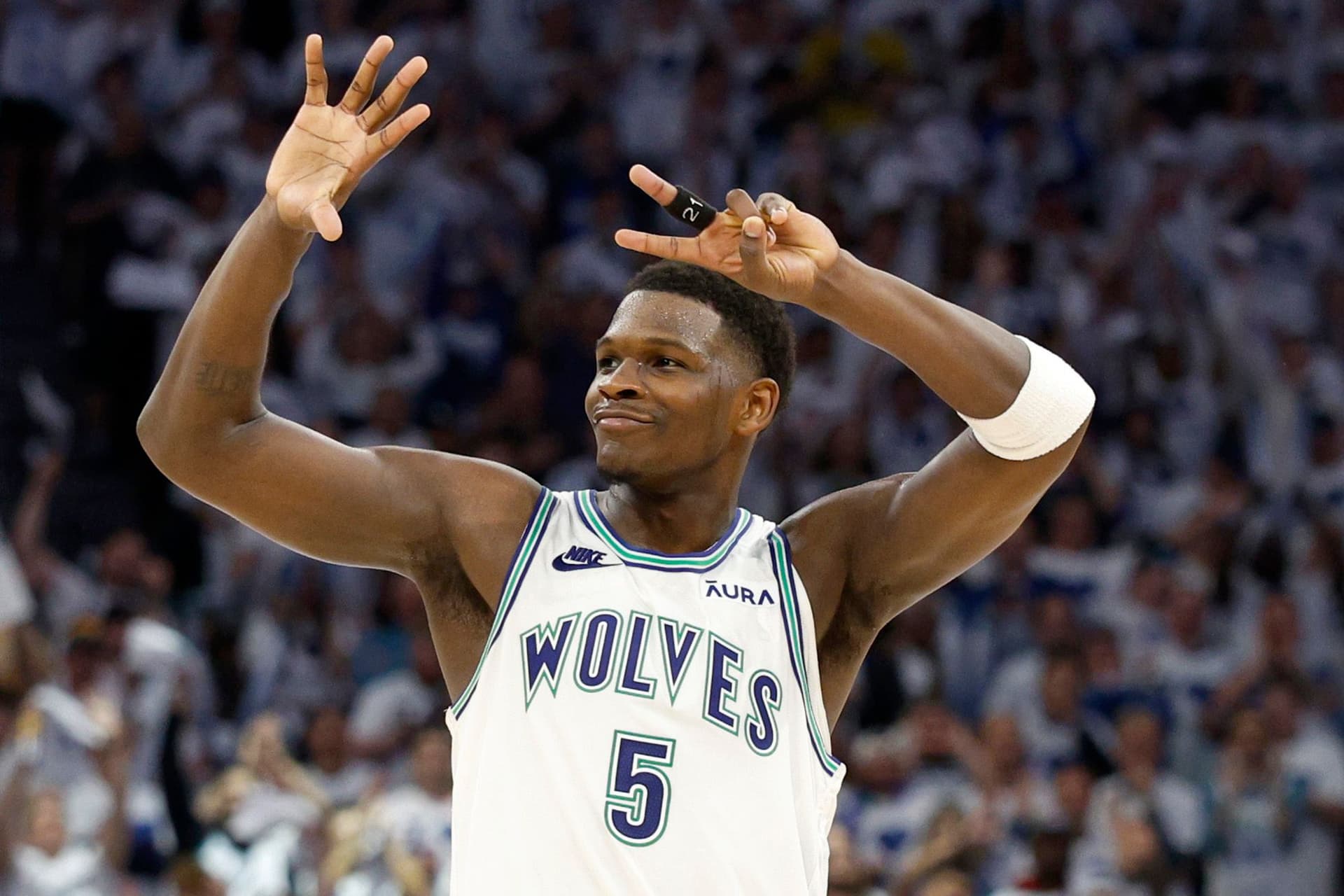 Anthony Edwards #5 of the Minnesota Timberwolves celebrates against the Denver Nuggets