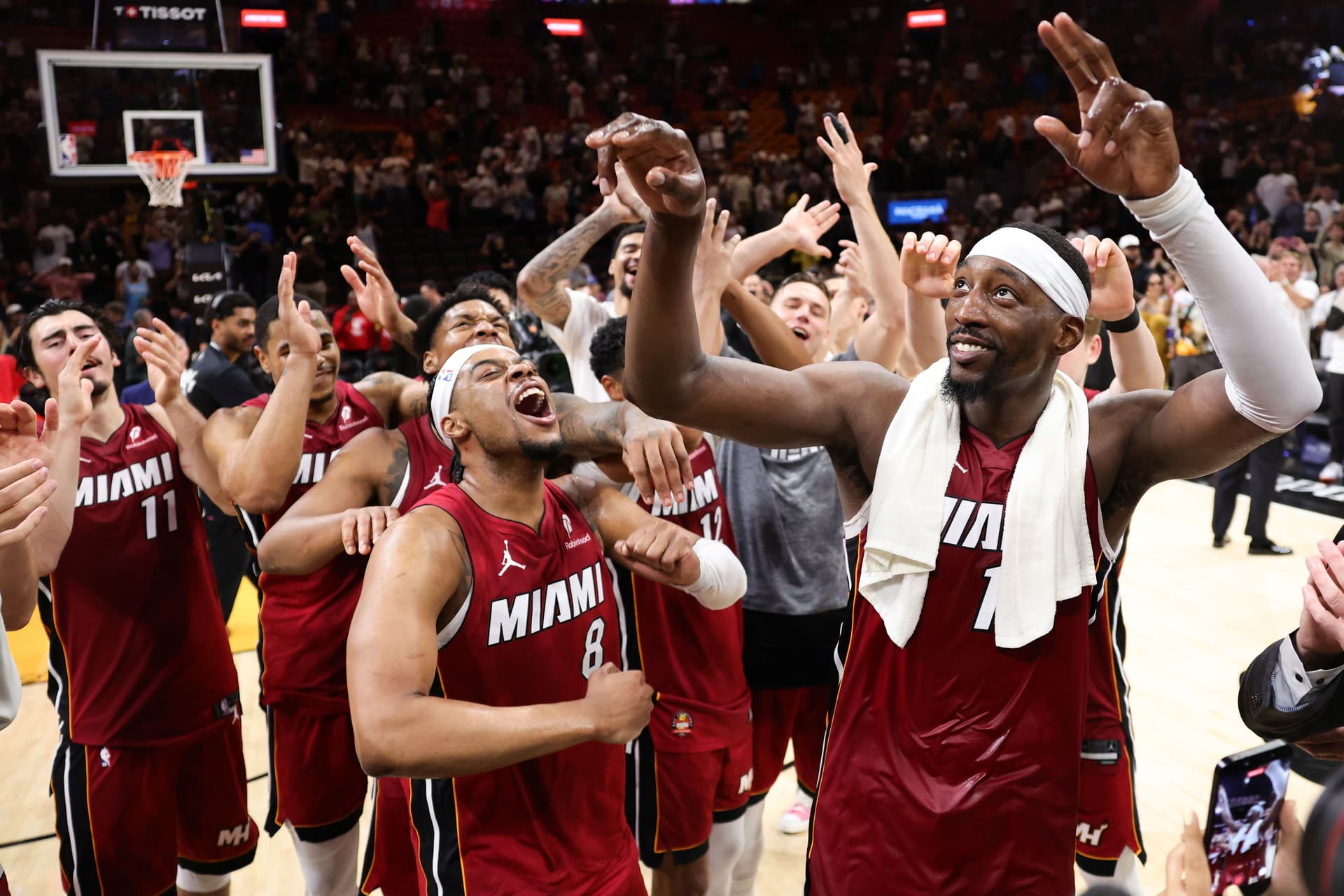 Bam Adebayo #13 of the Miami Heat celebrates with teammates after defeating the Washington Wizards