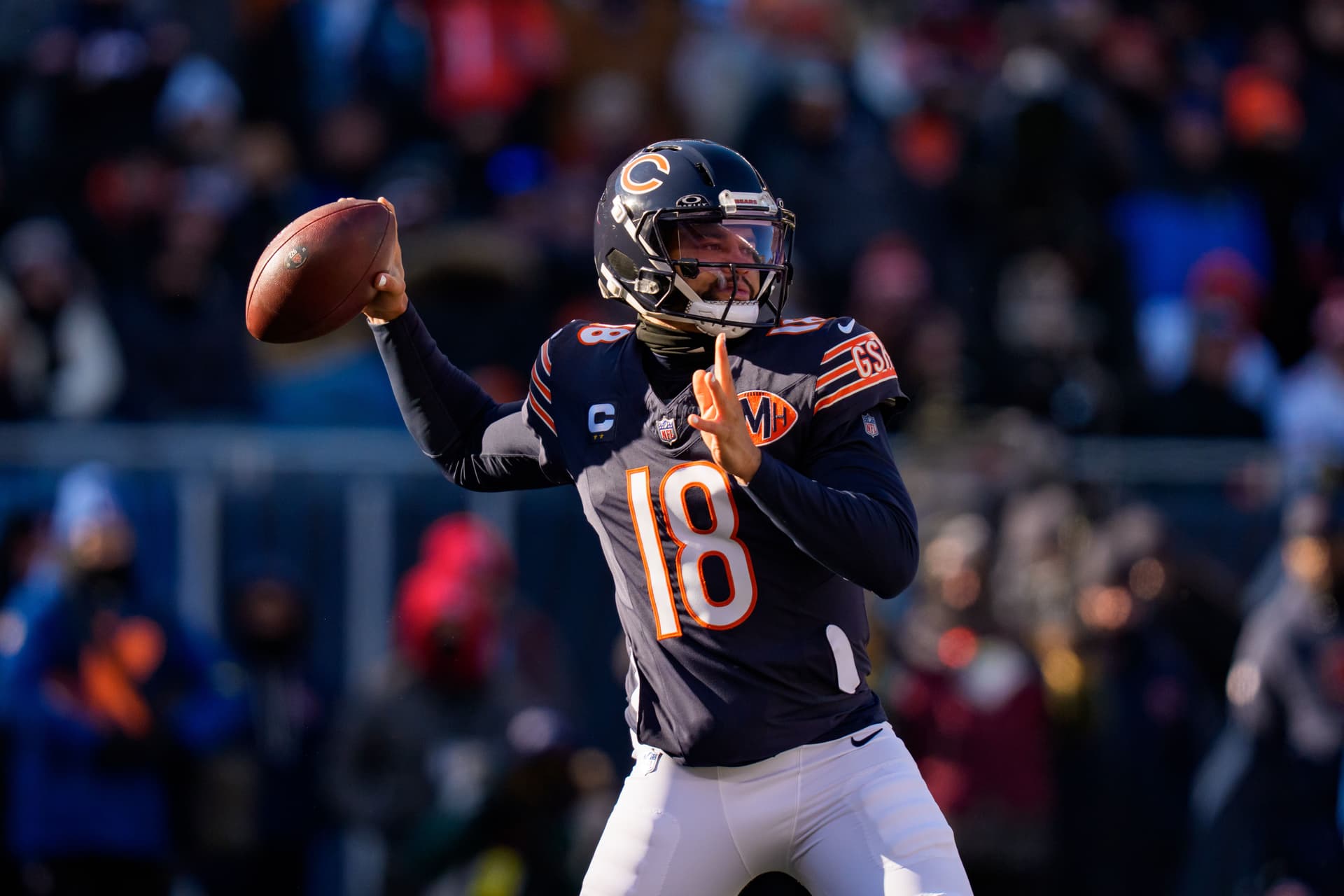 Caleb Williams #18 of the Chicago Bears sets to throw a pass