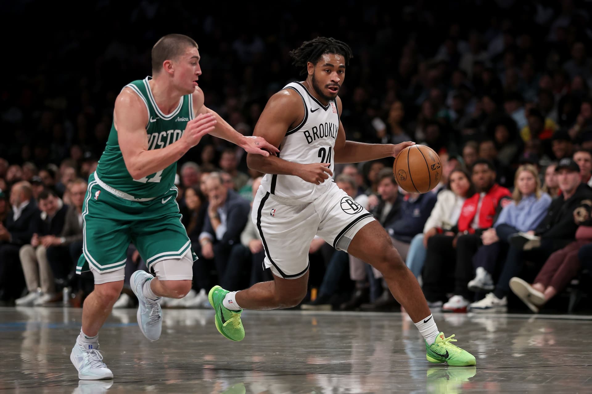 Cam Thomas drives against Payton Pritchard