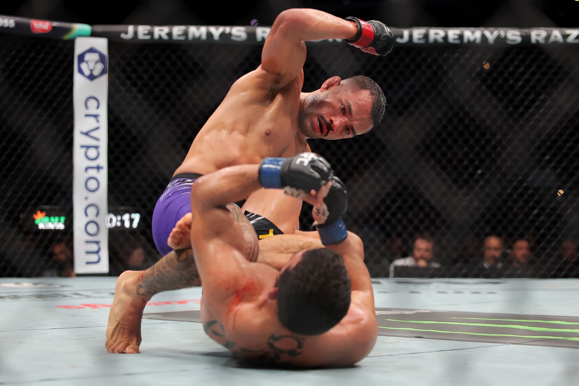 Dan Ige of the United States strikes Patrício Pitbull of Brazil