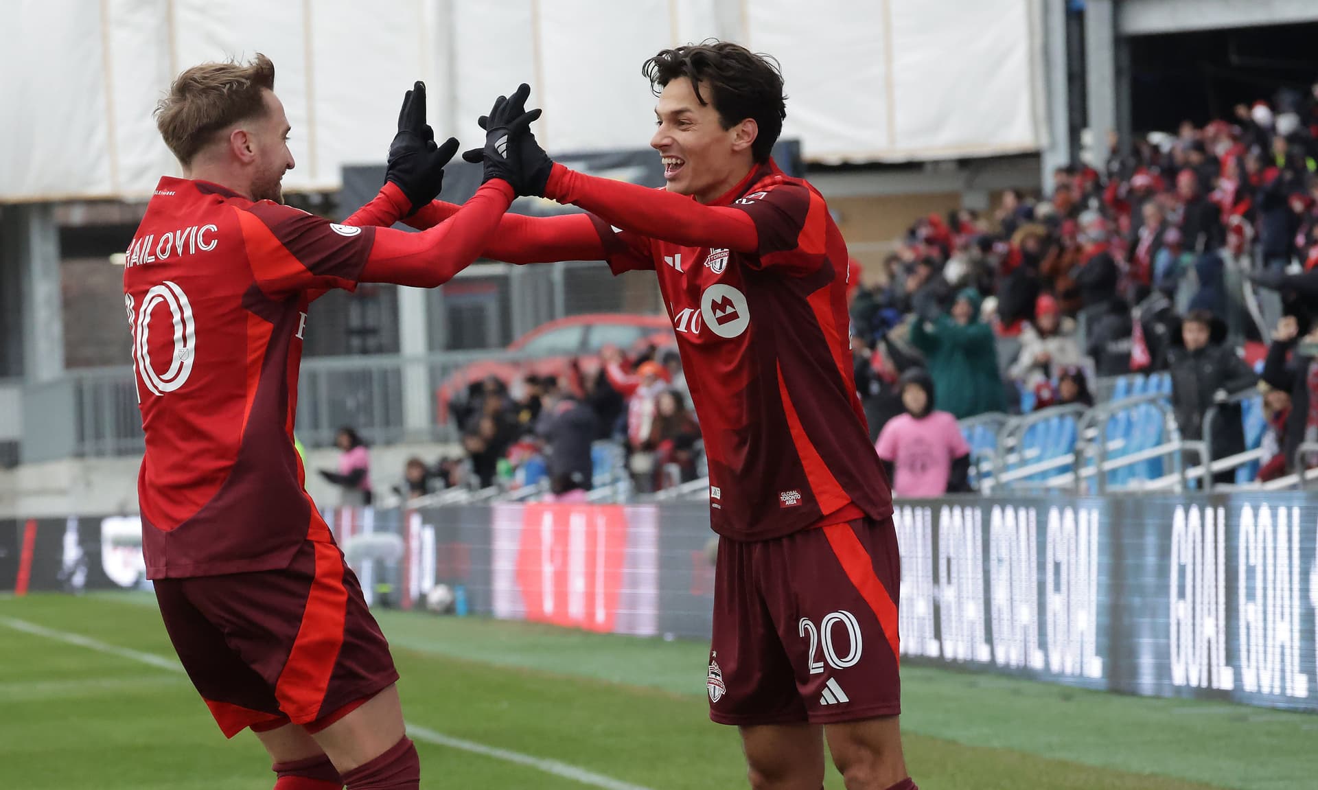 Dániel Sallói #20 of the Toronto FC celebrates after scoring with Djordje Mihailovic #10 of the Toronto FC / Getty Images