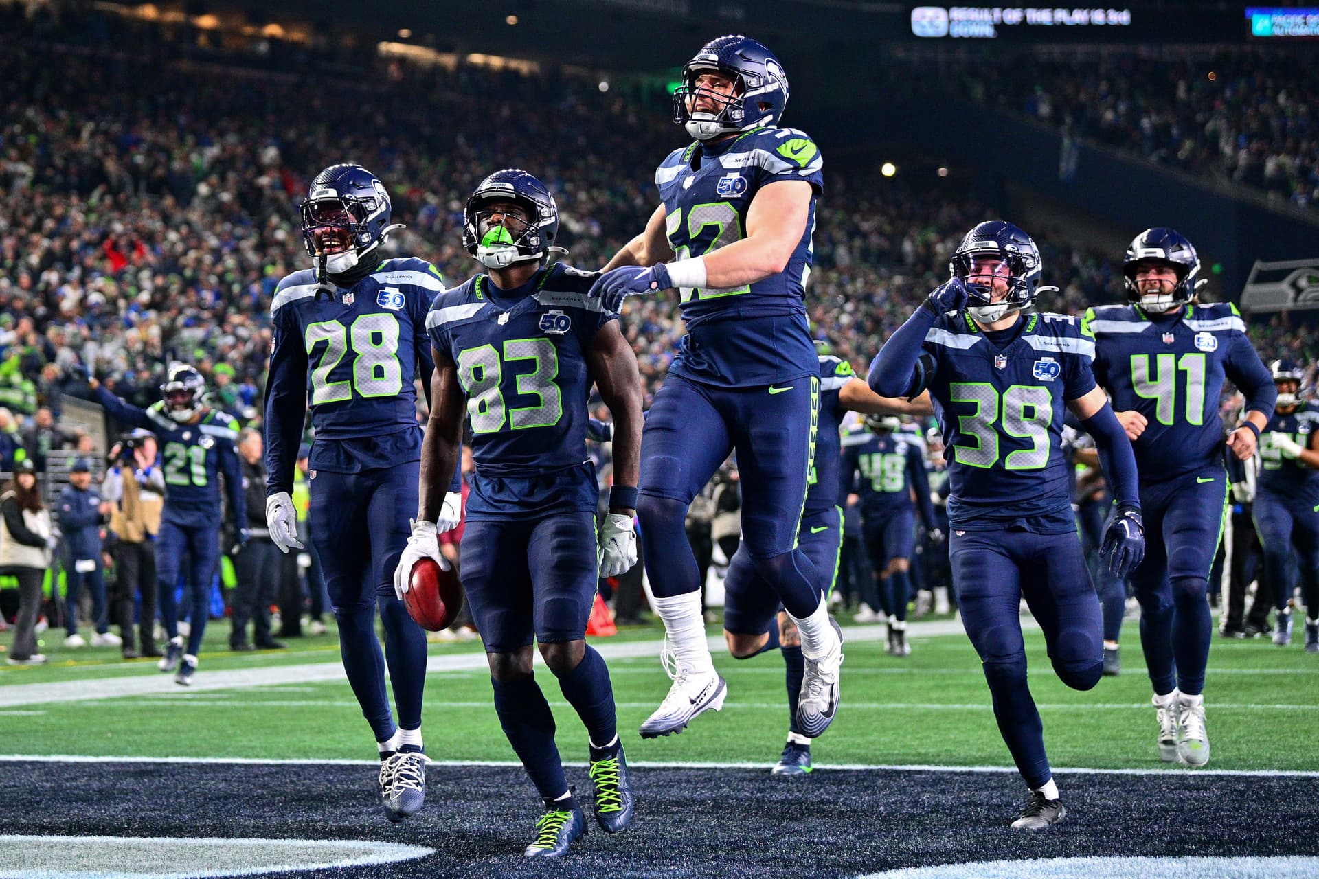 Dareke Young #83 of the Seattle Seahawks celebrates with teammates