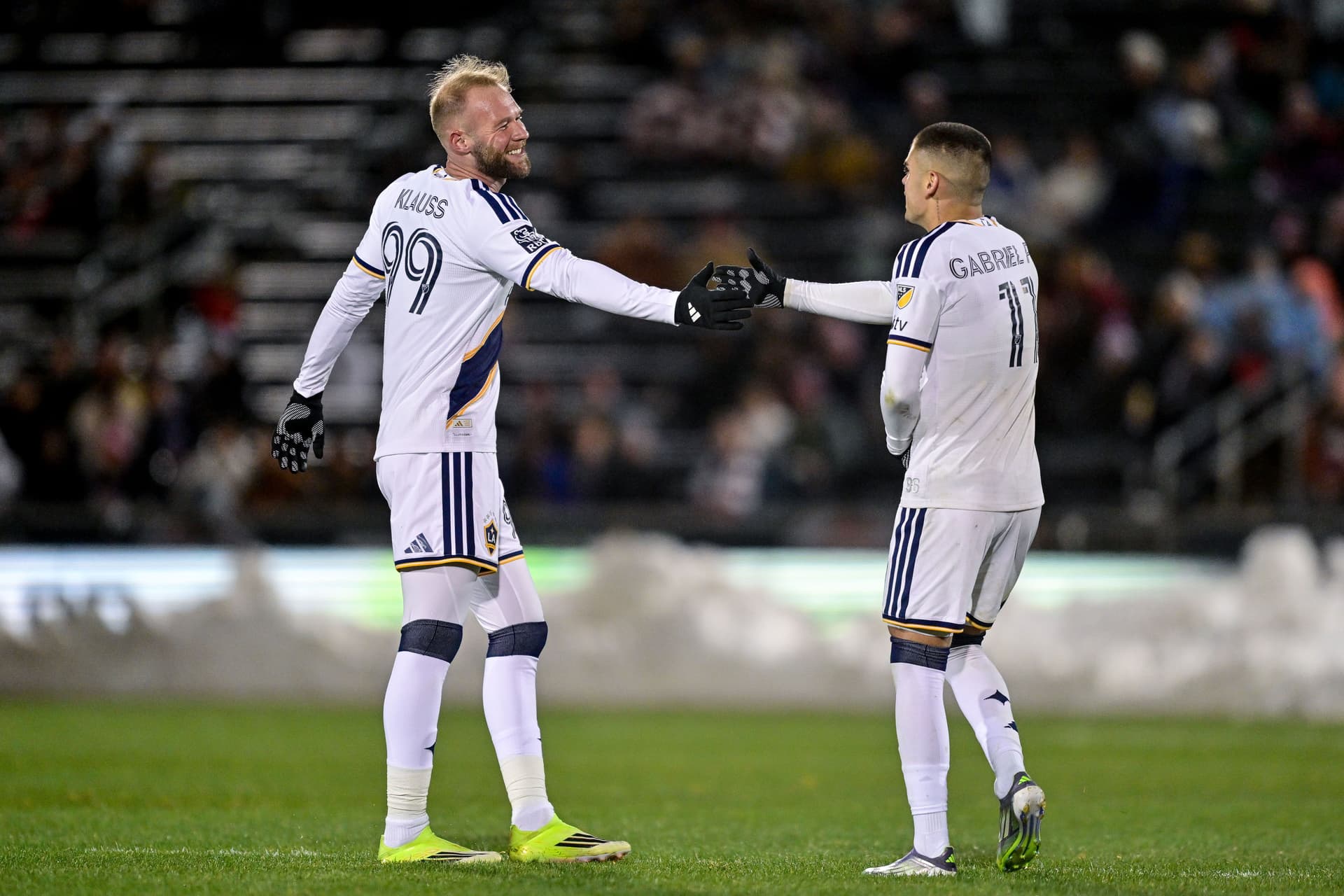 Gabriel Pec #11 and Klauss #99 of the Los Angeles Galaxy celebrate