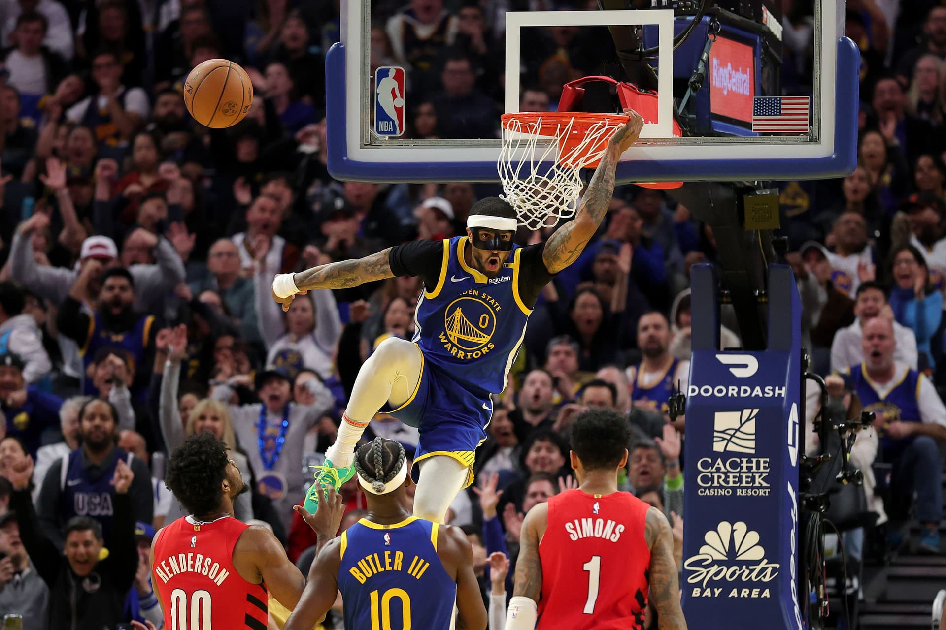 Gary Payton II #0 of the Golden State Warriors dunks the ball