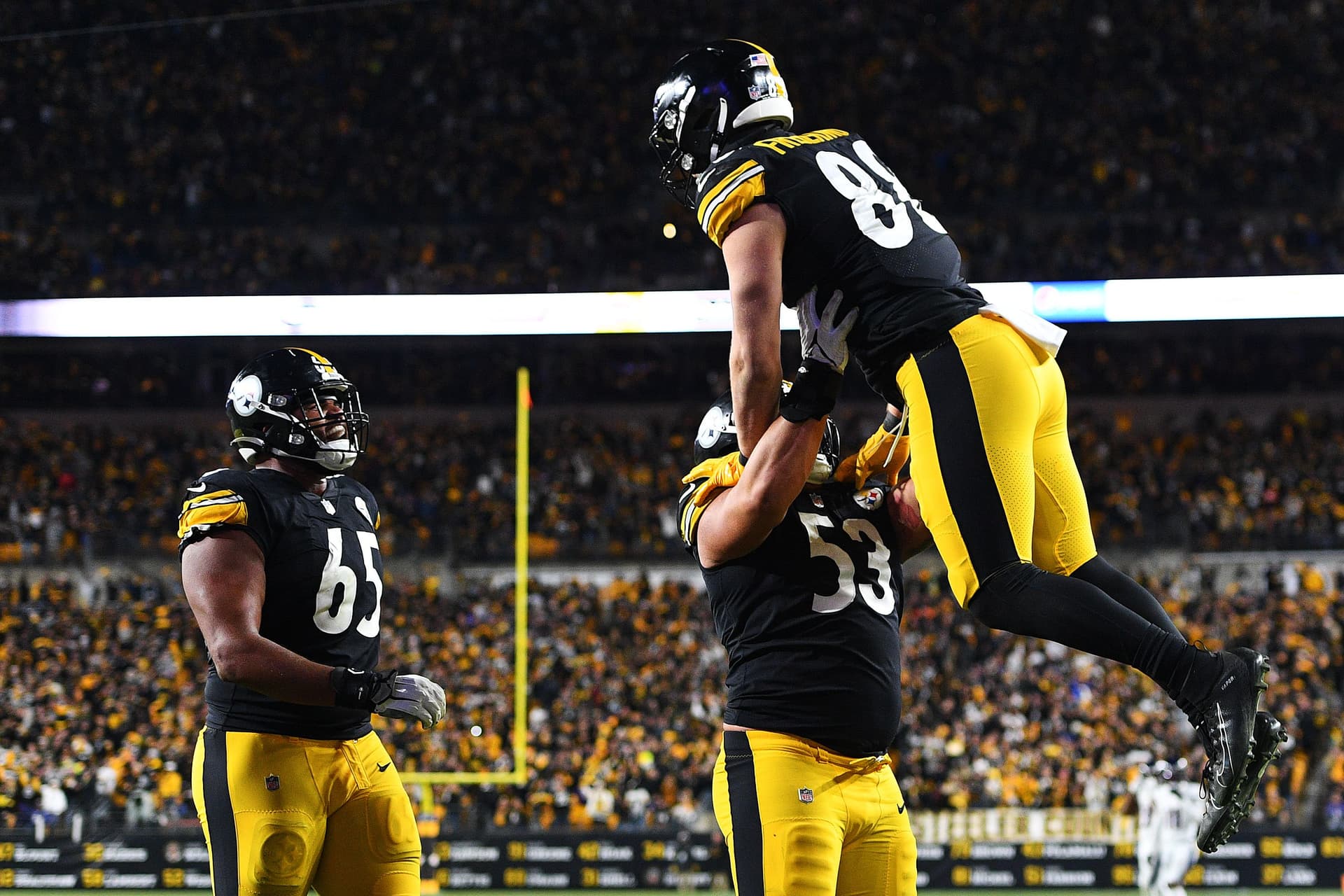 Pat Freiermuth #88 of the Pittsburgh Steelers celebrates a successful two point conversion with Kendrick Green