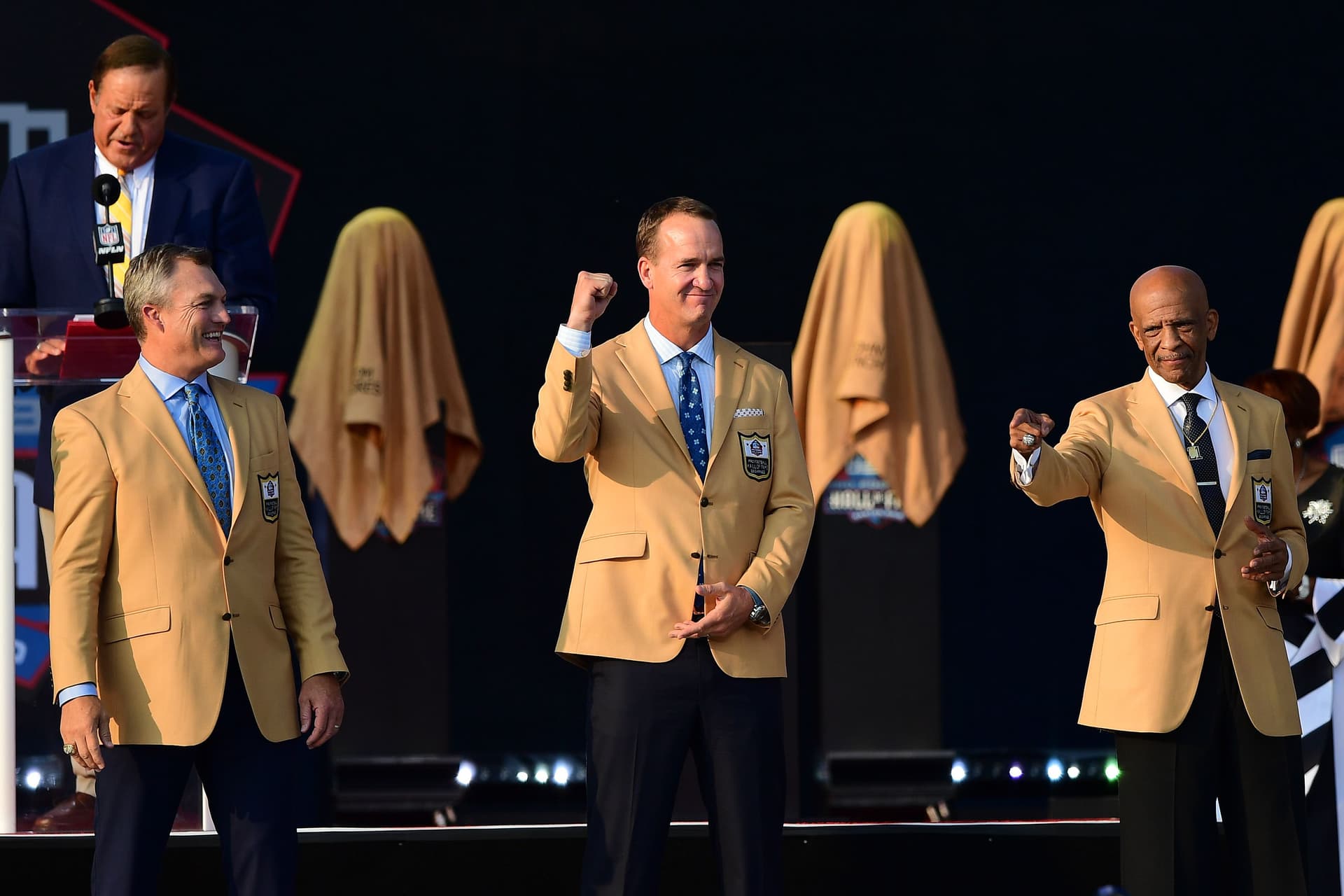John Lynch, Peyton Manning and Drew Pearson during the NFL Hall of Fame Enshrinement Ceremony