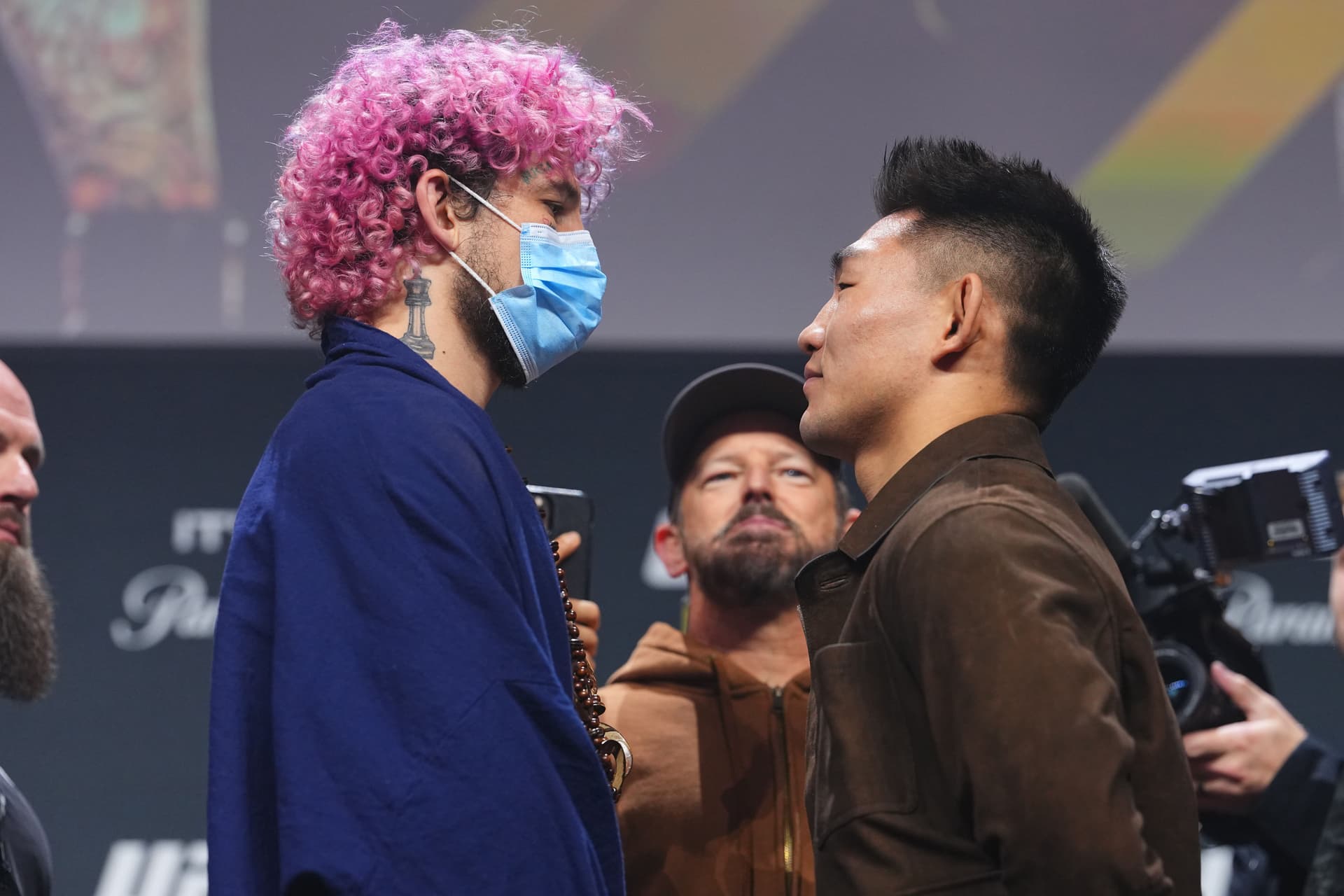 (L-R) Opponents Sean O'Malley and Song Yadong face off during the UFC