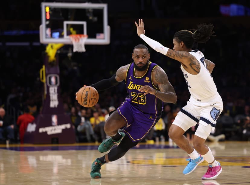 LeBron James #23 of the Los Angeles Lakers drives to the basket on Ja Morant #12