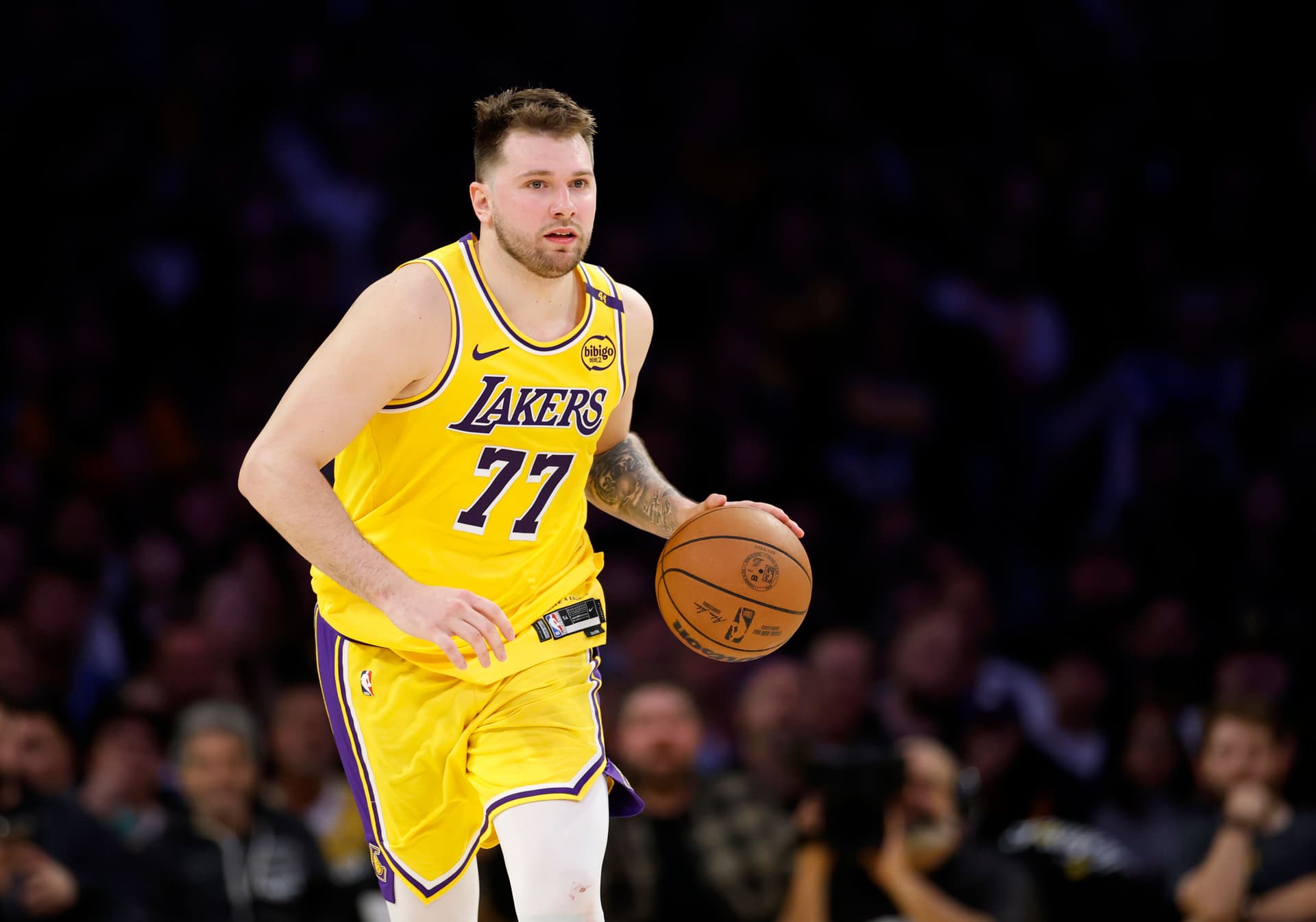 Luka Doncic #77 of the Los Angeles Lakers dribbles during a 103-96 loss to the Minnesota Timberwolves