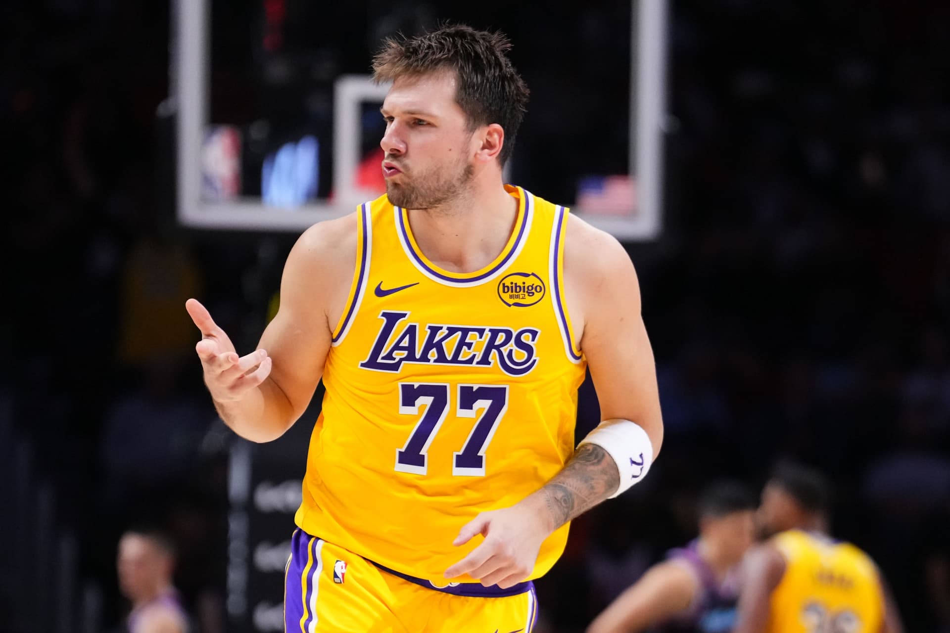 Luka Doncic #77 of the Los Angeles Lakers reacts after scoring a three-pointer