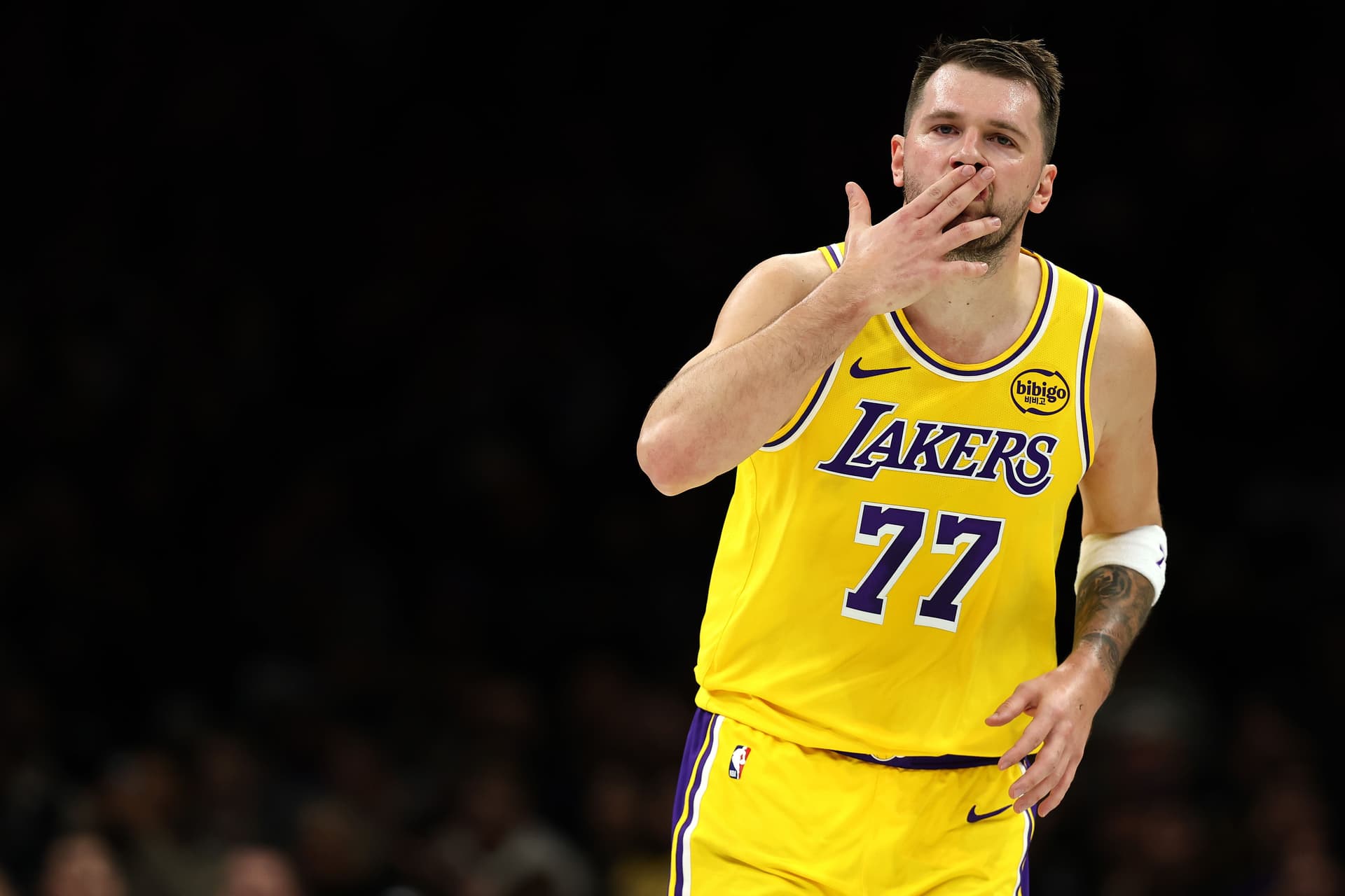 Luka Doncic #77 of the Los Angeles Lakers reacts after shooting a three-point basket during the first quarter