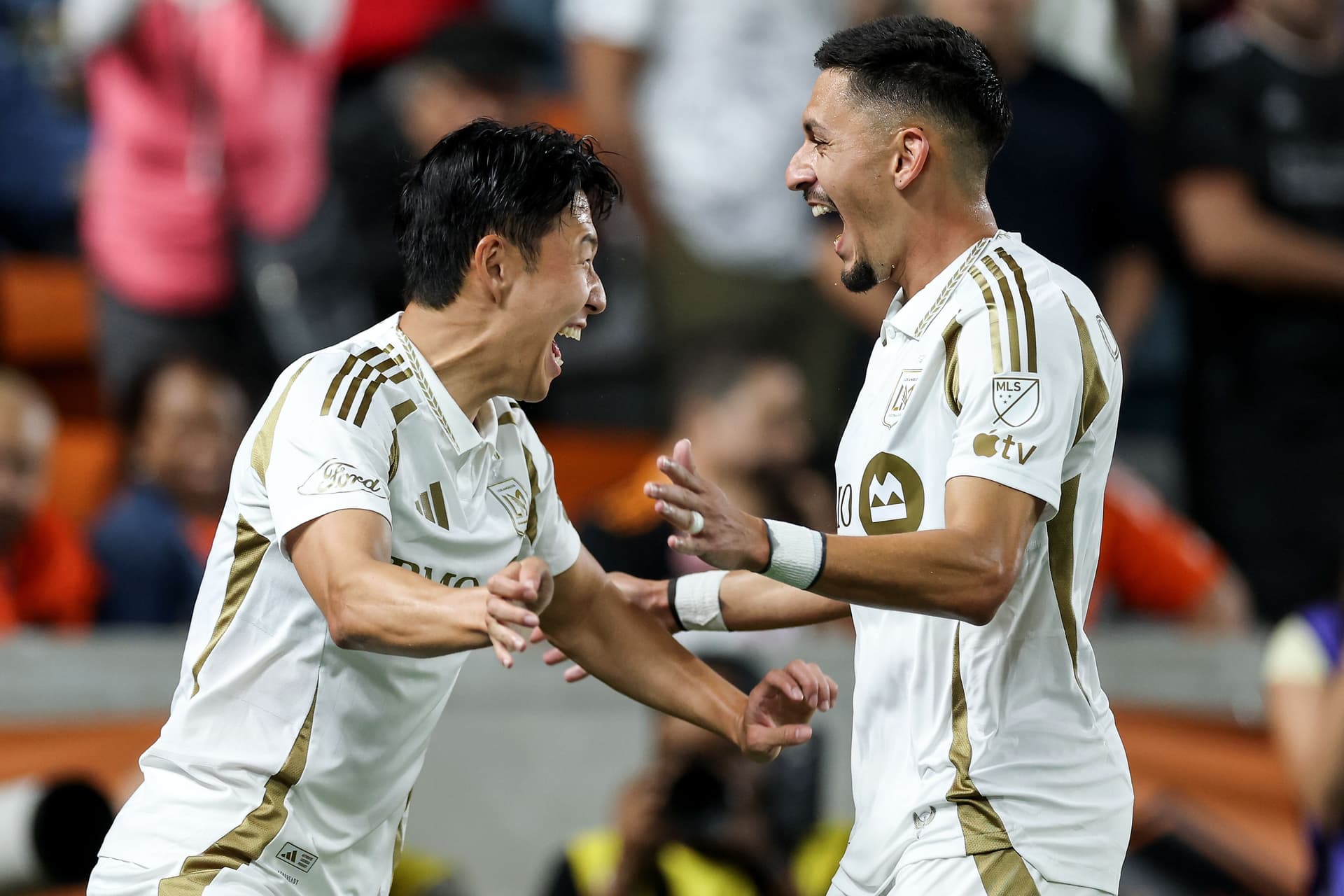 Mark Delgado #8 of the LAFC is congratulated by Son Heung-Min #7 after scoring a goal