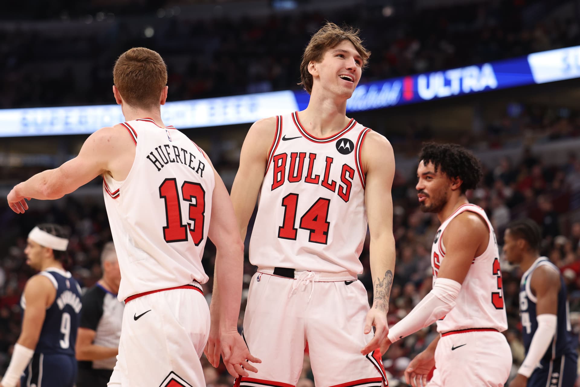 Matas Buzelis #14 of the Chicago Bulls celebrates with teammate Kevin Huerter