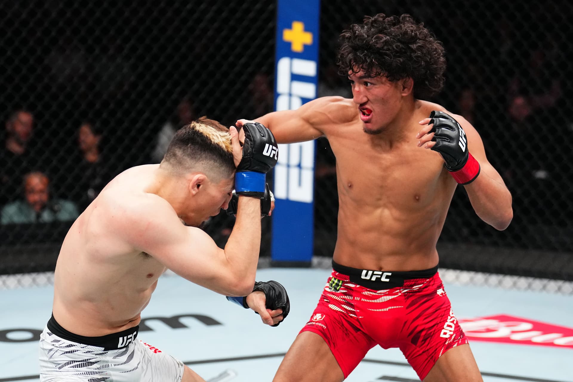 Raul Rosas Jr. punches Vince Morales in a bantamweight fight during the UFC Fight Night