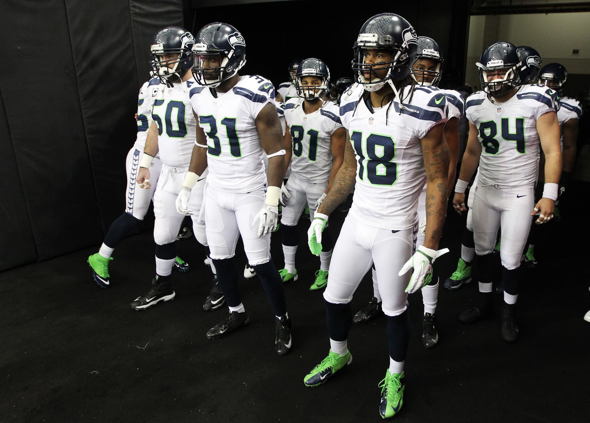 Sidney Rice of the Seattle Seahawks and his teammates prepare to take the field for their NFC Divisional Playoff Game