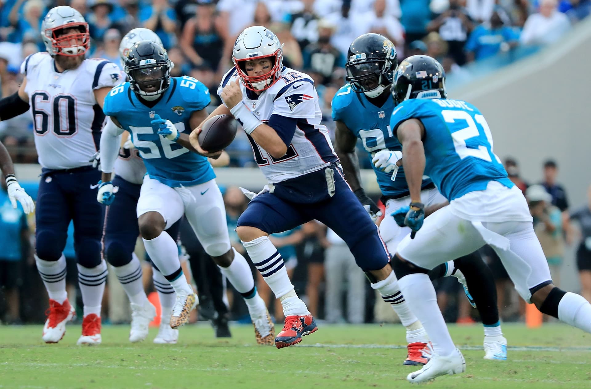 Tom Brady scrambles for yardage against the Jacksonville Jaguars